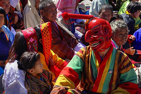 A masked jester with phallus mingles with the crowd, playing the fool, Thimphu Tsechu Festival, Tashichho Dzong, Bhutan, Asia