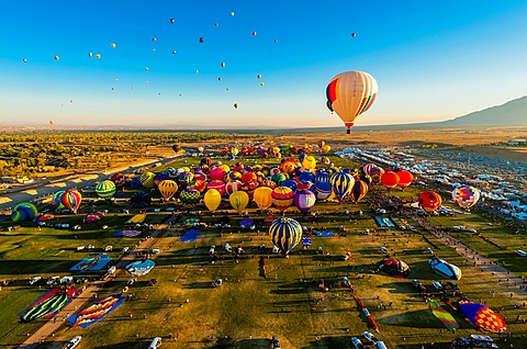 Aerial view, Hot air balloons lifting off from Balloon Fiesta Park, Albuquerque International Balloon Fiesta, Albuquerque, New Mexico USA