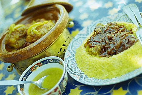 Traditional food of chicken tagine, and lamb with cous cous, Marrakech, Morocco, North Africa, Africa