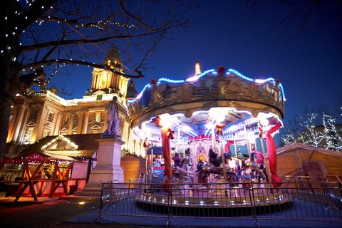 carousel at the christmas market in the grounds of belfast city hall northern ireland uk united kingdom