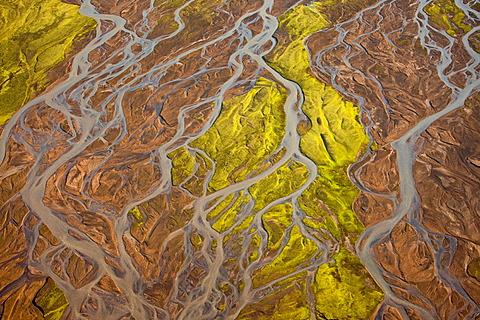 Aerial view displaying erosion patterns on flood plains left by jokulhlaups (glacier bursts) that occur when geothermal heat melts subglacial ice and water bursts through in a catastrophic flood.