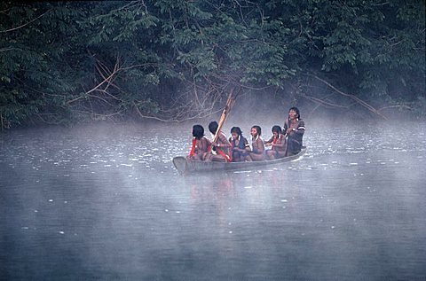 Kayapo amerindians,a misty boat ride, amazon,brazil