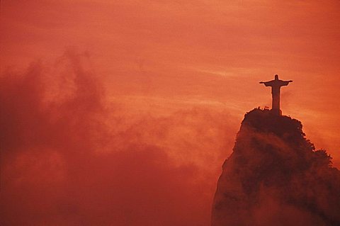 Statue of Jesus Christ on a hill at sunset, Christ the Redeemer Statue, Rio De Janeiro, Brazil