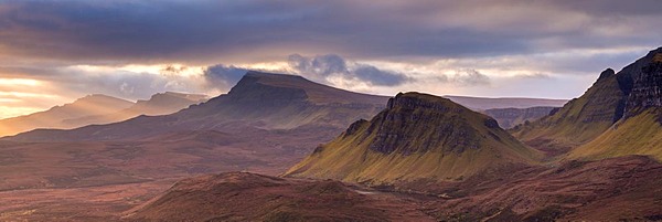 The Trotternish mountain range at dawn viewed from the Quiraing, Isle of Skye, Scotland. Winter (December) 2013.
