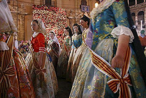 Flower Parade arriving for la Ofrenda, at Plaza de la Virgen by the Cathedral, during the annual Las Fallas festival in Valencia, Spain, Europe