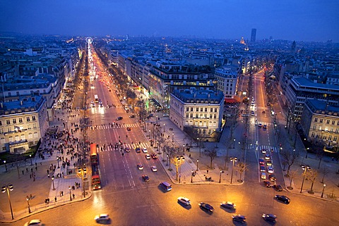 The Champs Elysees at night from the Arc de Triomphe, Paris, France, Europe