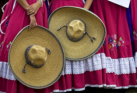 Members of the Metro team hold their sombreros during the awards ceremony at an Escaramuza in Mexico City, Sunday, February 10, 2008.  Escaramuzas are similar to US rodeos, where female competitors called "Amazonas" wear long skirts, and ride side saddle.