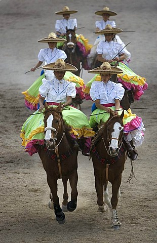 Members of the El Herradero team compete in an Escaramuza in Mexico City, Sunday, February 10, 2008.  Escaramuzas are similar to US rodeos, where female competitors called "Amazonas" wear long skirts, and ride side saddle.  Male rodeo competitors are "Char