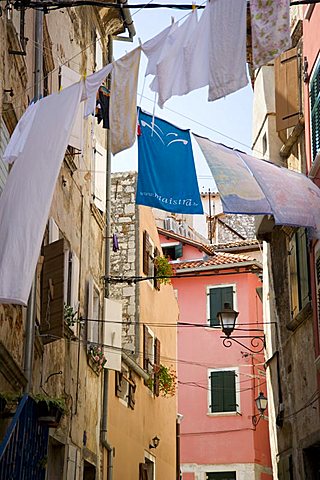 Laundry hanging in an alley of old buildings in Rovinj, Istria, Croatia, Europe