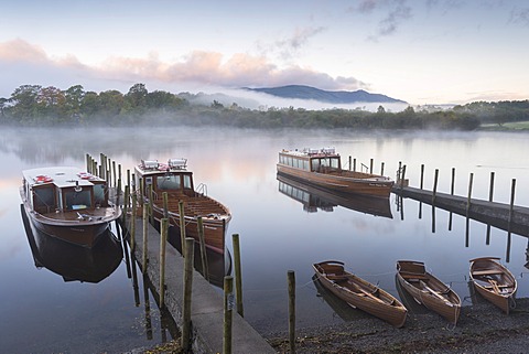 Boats moored on Derwentwater near Friar's Crag in autumn, Keswick, Lake District National Park, Cumbria, England, United Kingdom, Europe