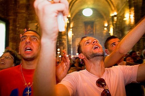Pilgrims singing during the descent of Mª Jacobe and Mª Salome relics Church Annual gipsy pilgrimage at Les Saintes Maries de la Mer may,Camargue, Bouches du Rhone, France