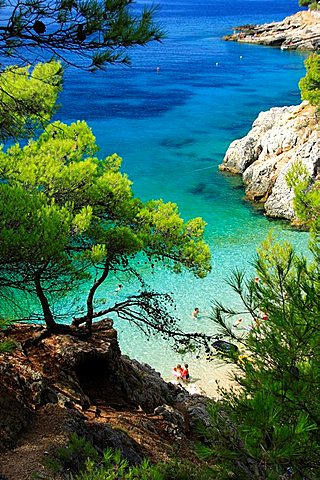 People on a beach in Jagodna village on Hvar Island, Croatia