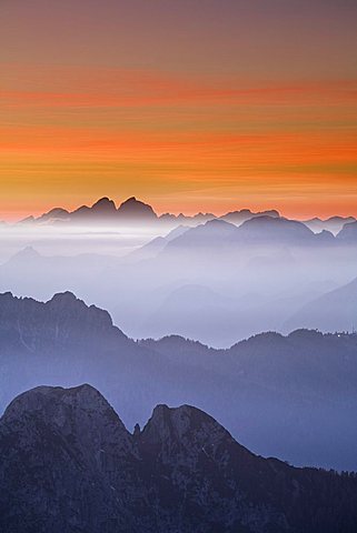 View over mountaintops at dusk from Mangrt Pass looking from Slovenia towards Italy at sunset, Triglavski National Park, Julian Alps, Slovenia, Europe