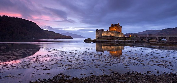 Twilight over Eilean Donan Castle on Loch Duich, Dornie, Scotland. Winter (November) 2013.