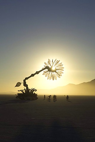 BLACK ROCK CITY, NV, SEPTEMBER 5:  The sun rises behind the mobile art work titled "Miracle Grow" by Patrick Shearn, Abundant Sugar and the DoLab of Los Angeles in Black Rock City, Nevada on September 5, 2005.  The city is home to Burning Man, an annual on