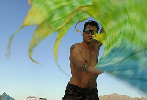 A dancing man at Burning Man Festival in the Red Rock Desert of Nevada.