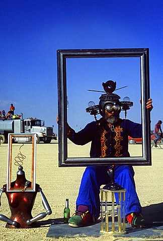 A man makes himself into a piece of art at Burning Man in the Black Rock Desert, Nevada on August 29, 2002.  Burning Man is an art festival that celebrates free expression.  In 2002 about 29,000 people attended the festival that started in 1986 when Larry