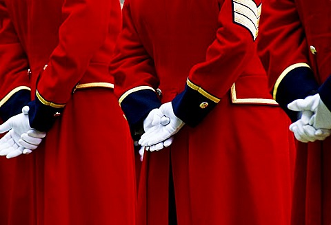 Details of traditional red coat uniforms of Chelsea Pensioners