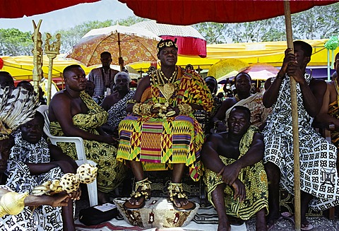 Ashanti (Asante) tribe chief, adorned with jewellery of local gold, at a tribal feast at Accra in Republic of Ghana, West Africa