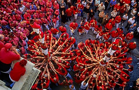 Colla Joves Xiquets de Valls Castellers building human tower, a Catalan tradition Plaça del Blat Valls Tarragona province, Catalonia, Spain