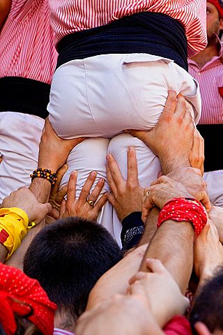 Xiquets de Tarragona 'Castellers' building human tower, a Catalan tradition Placa de la Vila de Gracia Barri de Gracia Barcelona, Spain