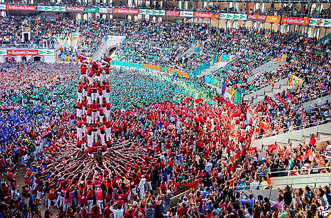 Colla Joves Xiquets de Valls 'Castellers' building human tower, a Catalan tradition Biannual contest bullring Tarragona, Spain