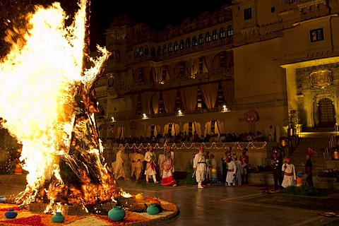 Shriji Arvind Singh Mewar of Udaipur, 76th Custodian of the House of Mewar, presides at annual Hindu Holi Fire Festival at The Zenana Mahal in the City Palace, Udaipur, Rajasthan, India. With him is wife  Maharani Vijaya Laxmi and son  and heir Lakshyaraj