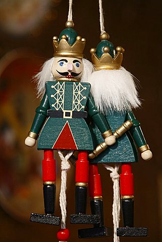 Close-up of painted wooden figures at shop in the Christmas market in Munich winter garden, Munich, Bavaria, Germany, Europe