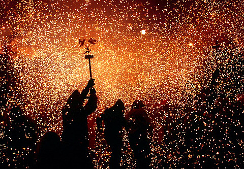 Sparks rain down on revellers during the Correfoc Fire Run - part of the annual festival of La Merce  Barcelona, Catalunya, Spain