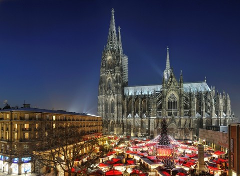 Christmans Market on Roncalli Place with Cathedral at Night, Cologne, Germany