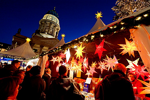 Night view of busy traditional German Christmas Market in Gendarmenmarkt in Mitte Berlin Germany