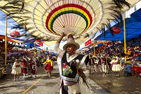 Suri Sicuri dancer wearing an elaborate feather headdress in the procession of the Carnaval de Oruro, Oruro, Bolivia