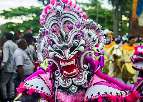 Colourful dressed masked man in the Carneval (Carnival) in Santo Domingo, Dominican Republic, West Indies, Caribbean, Central America