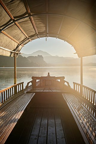 View at castle at Lake Bled from a typical Gondola, mist, steam, Julian Alps, Gorenjska, Slovenia