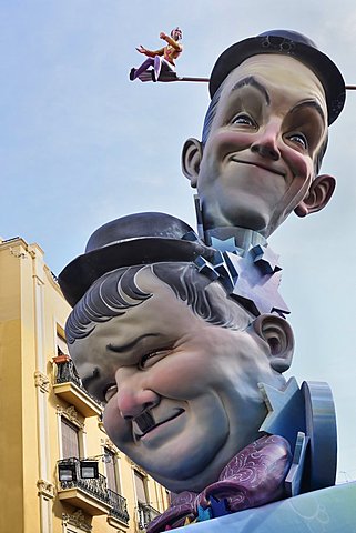 Spain, Valencia Province, Valencia, Papier Mache versions of Laurel and Hardy in the street during Las Fallas festival.