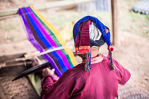 Palaung woman weaving, part of the Palau Hill Tribe near Hsipaw Township, Shan State, Myanmar (Burma)