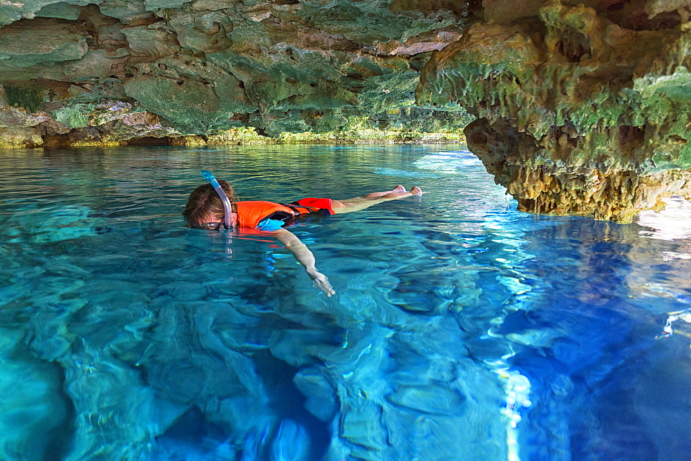 Man snorkeling in Cenote Chikin Ha, Playa del Carmen, Mayan Riviera, Yucatan Peninsula, Mexico